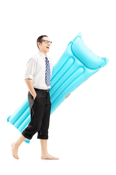 Man holding swimming mattress — Stock Photo, Image