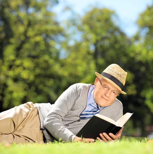 Senior gentleman with a book — Stock Photo, Image