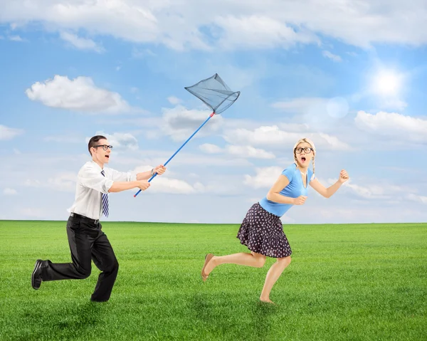 Female runaway from man with butt — Stock Photo, Image