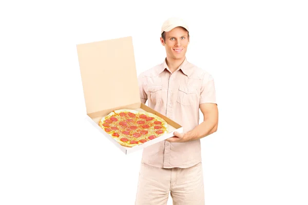 Delivery boy holding pizza — Stock Photo, Image