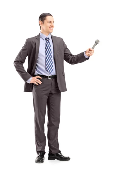 Male reporter holding microphone — Stock Photo, Image