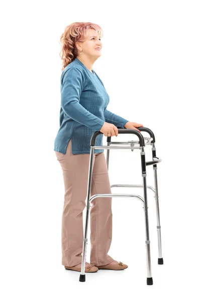 Mature woman with walker looking up — Stock Photo, Image