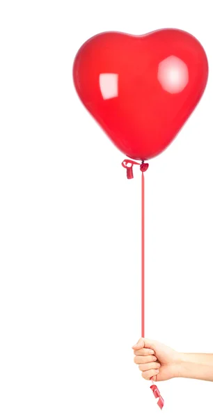 Ręka, trzymając balon w kształcie serca — Zdjęcie stockowe