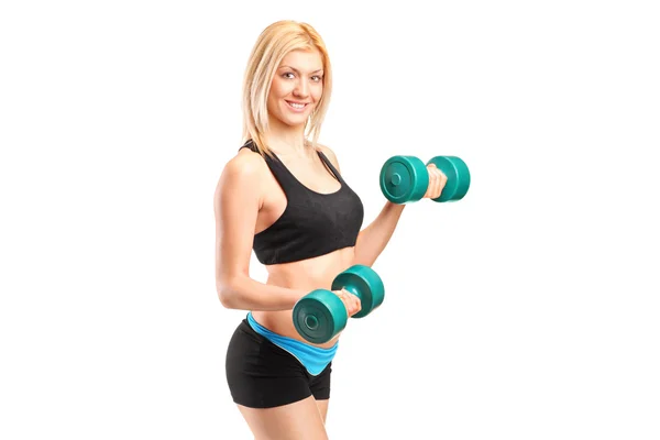 Woman lifting up weights — Stock Photo, Image