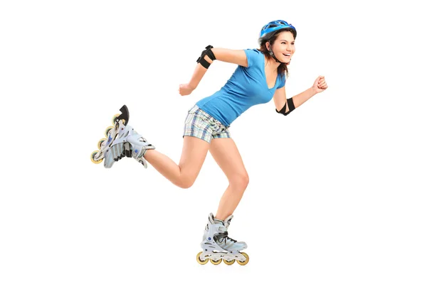 Smiling girl on rollers skating — Stock Photo, Image