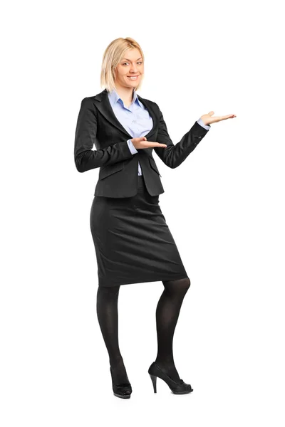 Female in suit gesturing welcome — Stock Photo, Image