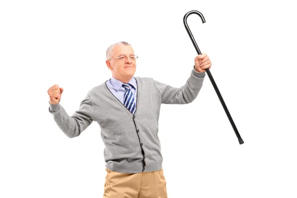 Senior hält Stock in der Hand — Stockfoto