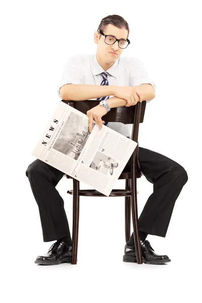 Disappointed businessperson sitting on chair — Stock Photo, Image