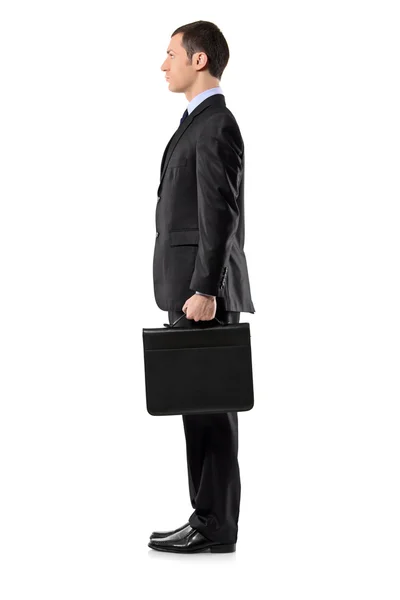 Businessman holding leather briefcas — Stock Photo, Image