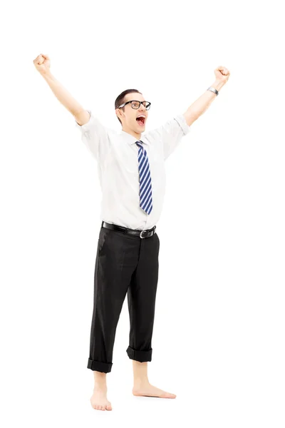 Excited barefooted guy with raised hands — Stock Photo, Image