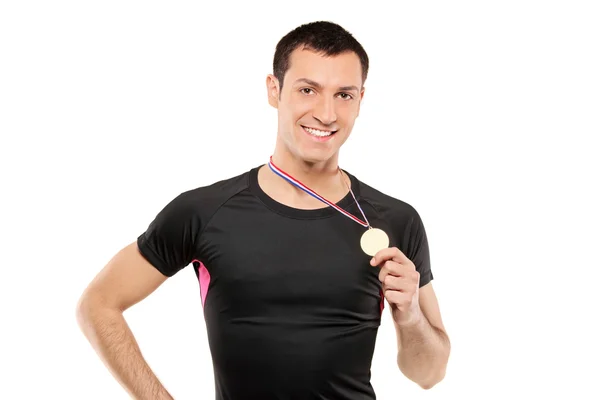 Sportsman holding gold medal — Stock Photo, Image