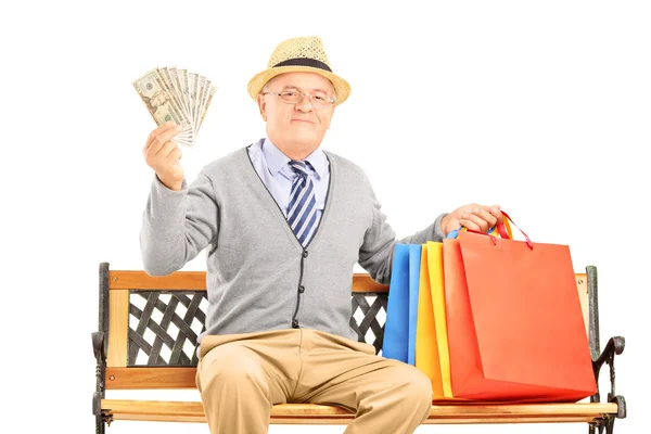 Lachende gentleman met shopping tassen — Stockfoto