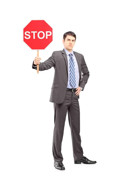 Hombre de negocios sosteniendo stop sign — Foto de Stock