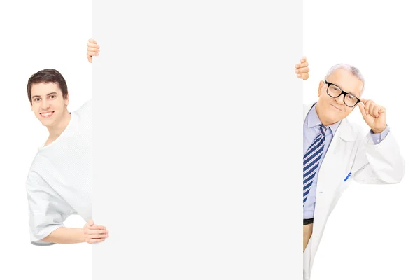 Patient and doctor standing behind panel — Stock Photo, Image