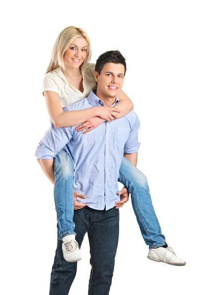 Female piggyback ride on boyfriends back — Stock Photo, Image