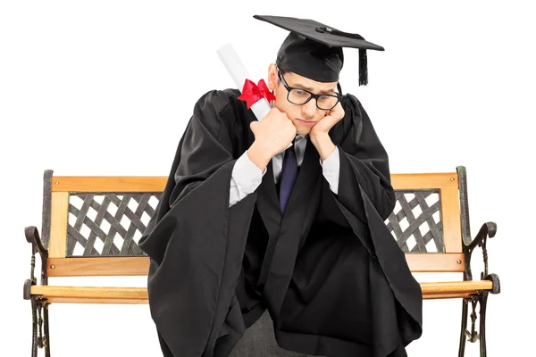 Estudante preocupado em vestido de graduação — Fotografia de Stock