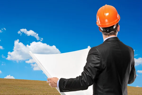 Architect holding blueprint — Stock Photo, Image