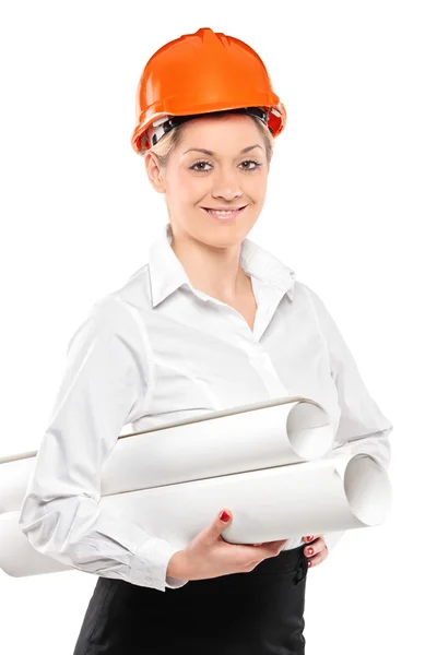 Female construction worker holding blueprints — Stock Photo, Image