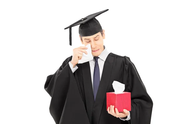 Sad young man in graduation gown — Stock Photo, Image