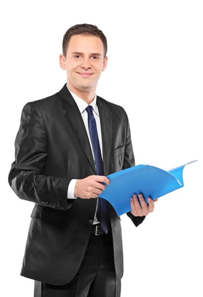 Confident businessman in black suit holding documents — Stock Photo, Image