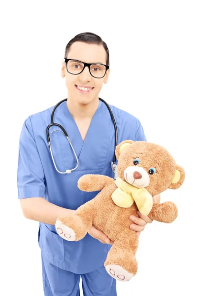 Healthcare professional in holding teddy bear — Stock Photo, Image