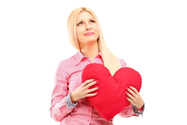 Kvinna anläggning röd hjärta — Stockfoto