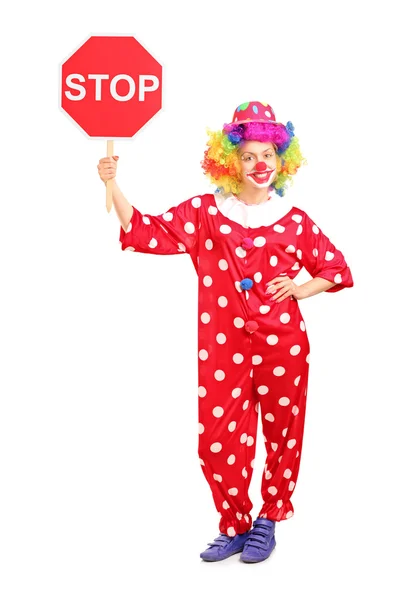 Клоун держит знак "стоп" — стоковое фото