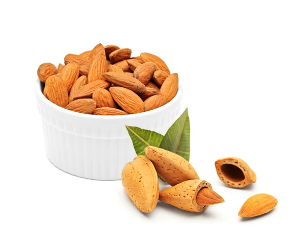 Almonds in porcelain bowl — Stock Photo, Image