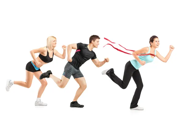 People running towards finish line — Stockfoto