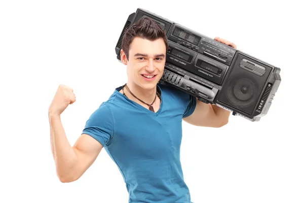 Homem muscular posando com rádio — Fotografia de Stock