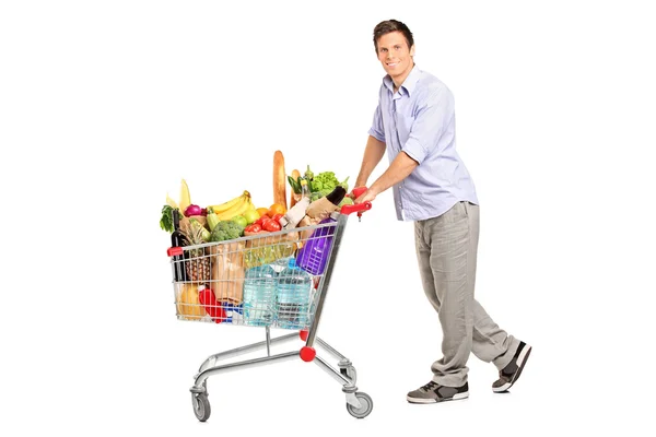 Male pushing shopping cart — Stock Photo, Image