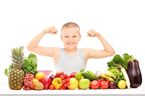 Boy showing muscles — Stock Photo, Image