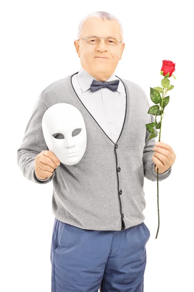 Gentleman holding rose and mask — Stock Photo, Image