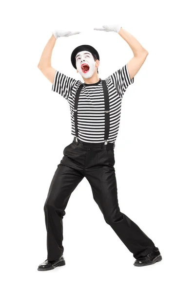 Mime artist simulate carrying something — Stock Photo, Image