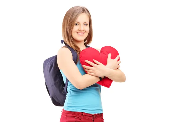 Female student holding red heart — Stock Photo, Image