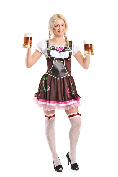 Woman holding beer glasses — Stock Photo, Image