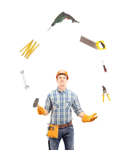 Robotnik żonglerka z narzędzia — Zdjęcie stockowe