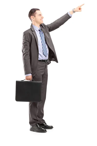 Businessman pointing in direction — Stock Photo, Image