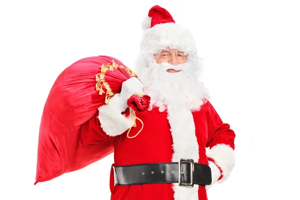 Santa claus poseren met zak — Stockfoto