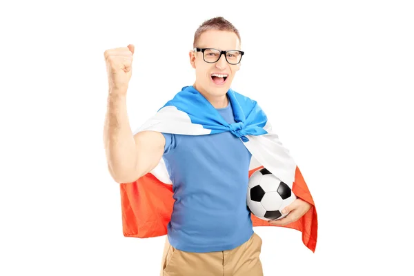 Male fan holding ball and flag — Stock Photo, Image