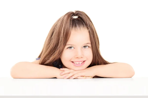 Girl sitting on table — Stock Photo, Image