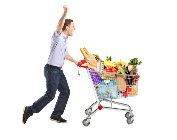 Man pushing shopping cart — Stock Photo, Image