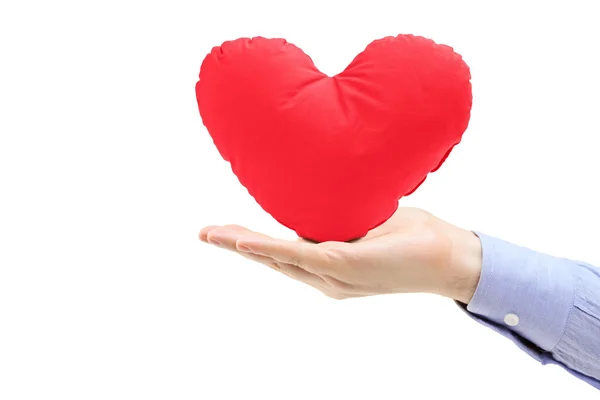 Hand bedrijf hartvormige kussen — Stockfoto