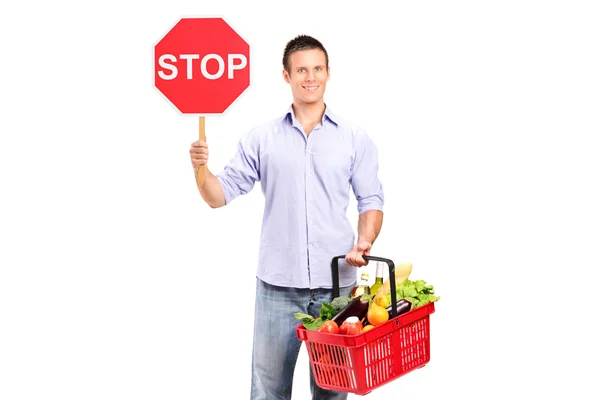 Male holding shopping basket — Stock Photo, Image