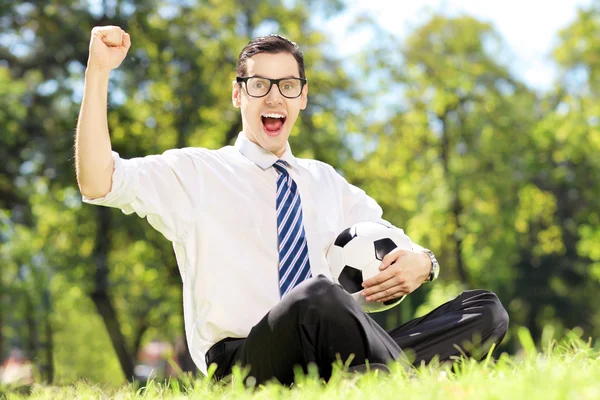 Man holding a ball and gesturing happiness — Stock Photo, Image