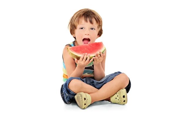 Boy holding slice of watermelon — Stock Photo, Image