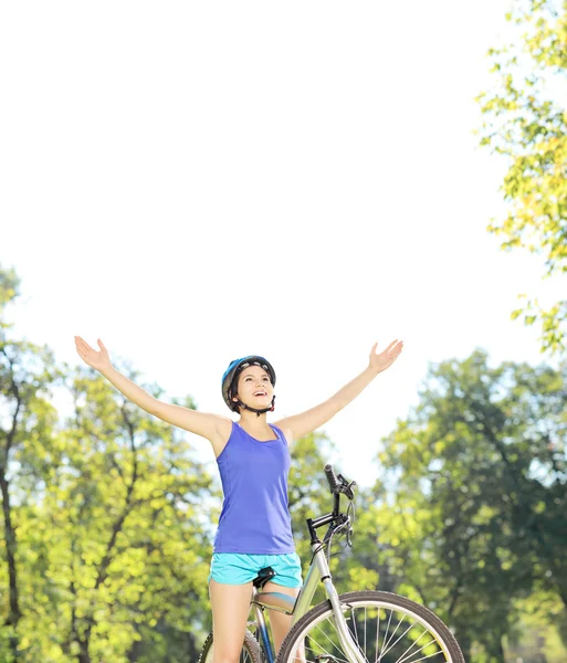 Female biker with raised hands — Stock Photo, Image