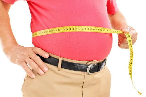 Dicker Mann misst seinen Bauch — Stockfoto