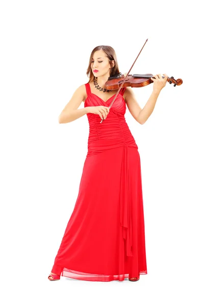 Emale in red dress playing violin — Stock Photo, Image