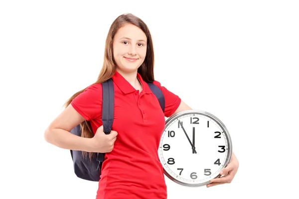 Estudante feminino segurando relógio — Fotografia de Stock